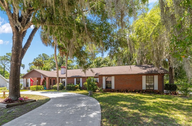 ranch-style house with a front lawn