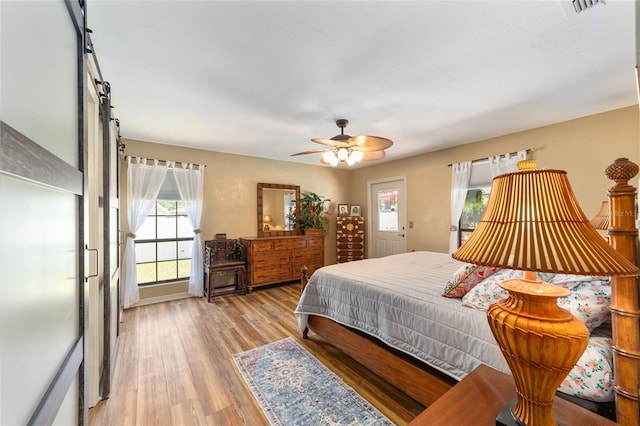 bedroom featuring ceiling fan and light hardwood / wood-style floors