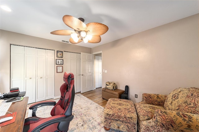 office area featuring light hardwood / wood-style floors and ceiling fan