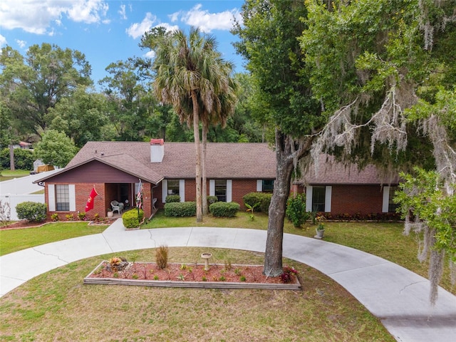 single story home featuring a front yard