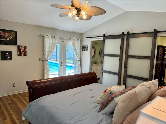 bedroom with lofted ceiling, access to exterior, ceiling fan, a barn door, and dark hardwood / wood-style floors