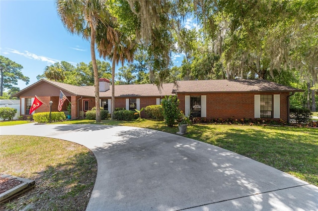 ranch-style house with a front lawn