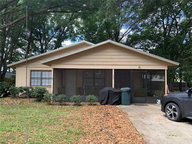 view of front of property with a sunroom