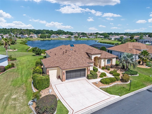 view of front facade with a garage and a water view