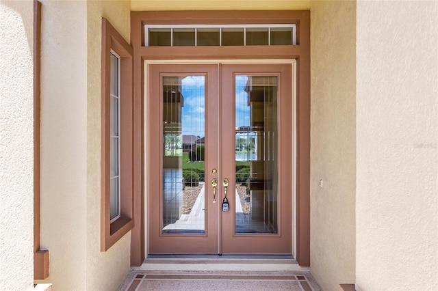 view of exterior entry featuring french doors