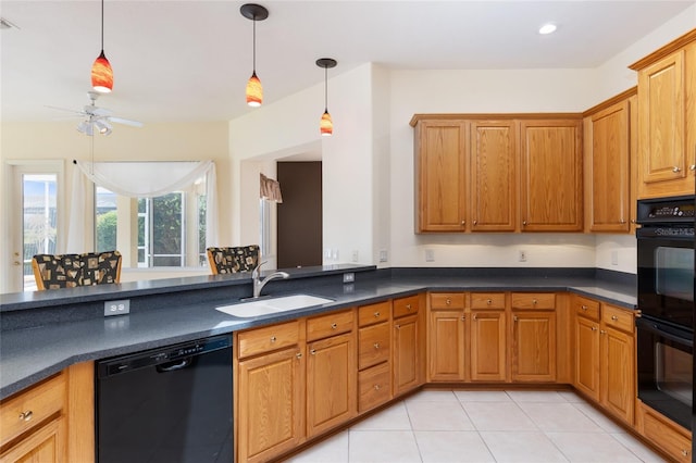 kitchen featuring black appliances, sink, hanging light fixtures, ceiling fan, and light tile patterned floors