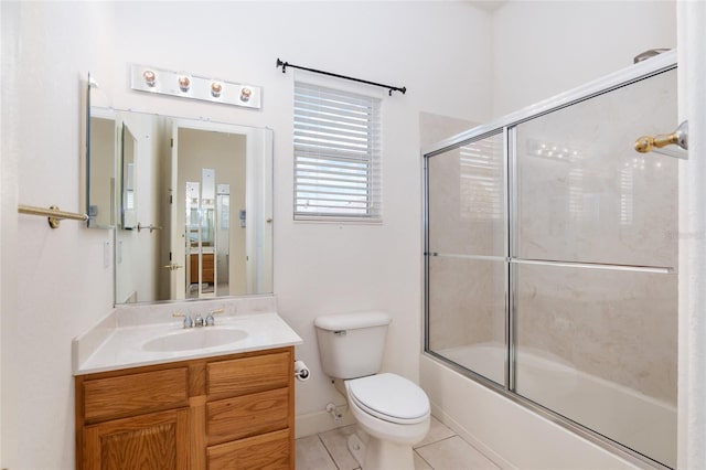 full bathroom featuring tile patterned flooring, vanity, toilet, and enclosed tub / shower combo