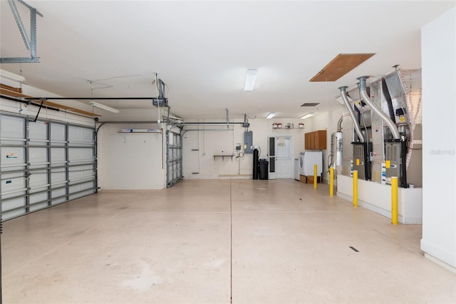 garage with electric panel and a garage door opener