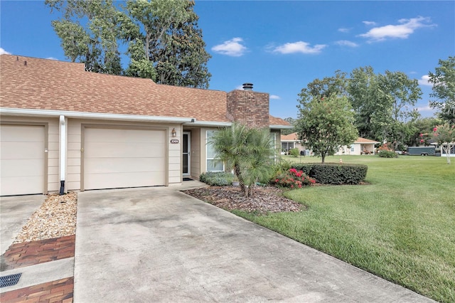 ranch-style house with a front lawn and a garage