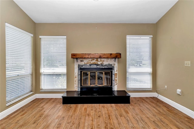 unfurnished living room featuring hardwood / wood-style floors