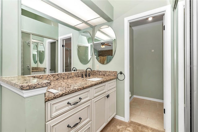 bathroom featuring tile patterned floors, ceiling fan, and vanity