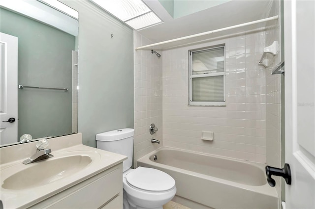 full bathroom with vanity, toilet, and tiled shower / bath