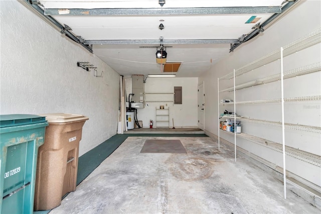 garage with electric panel and a garage door opener