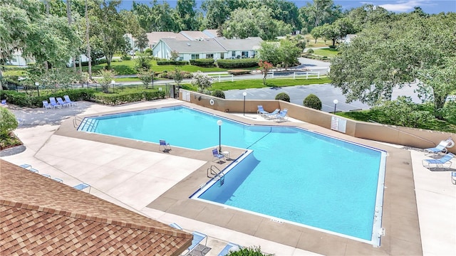 view of swimming pool with a patio