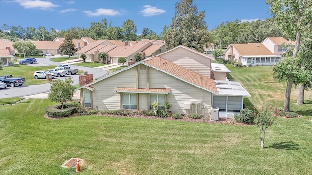 rear view of house with a yard