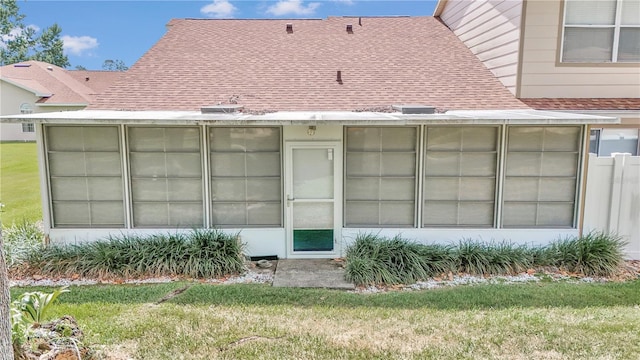 rear view of house with a yard