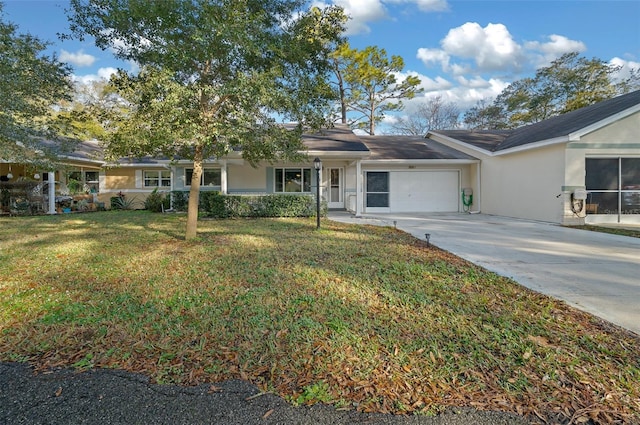 single story home with driveway, a front lawn, and stucco siding