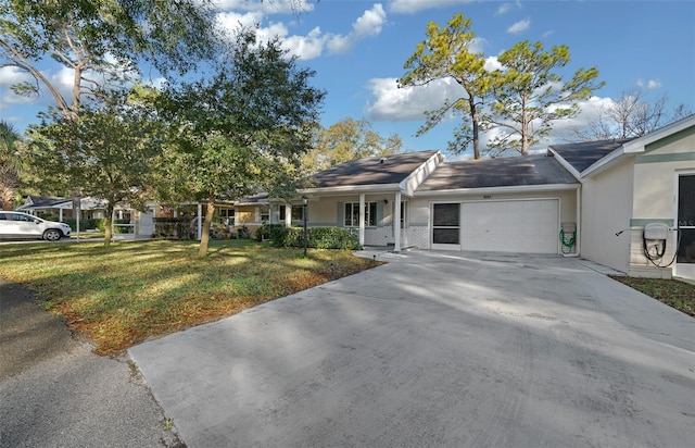 ranch-style home with a garage, covered porch, a front lawn, and concrete driveway