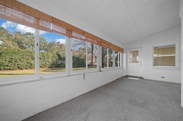 unfurnished sunroom with lofted ceiling