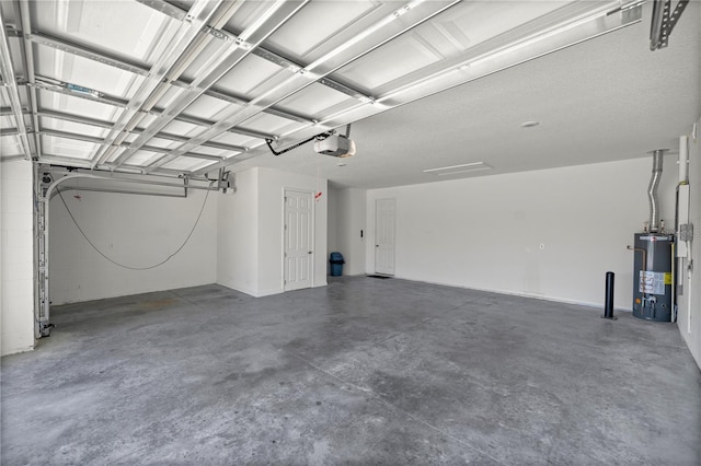 garage with a garage door opener and water heater