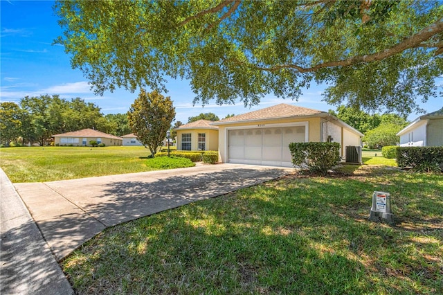 ranch-style home with a front yard, central AC, and a garage