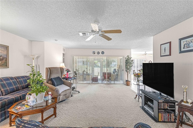 carpeted living room featuring a textured ceiling