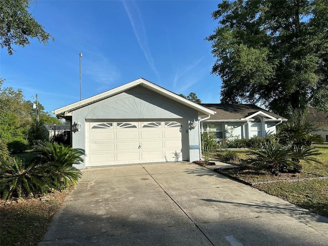 single story home featuring a garage