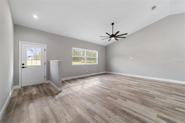 entryway featuring light hardwood / wood-style floors, lofted ceiling, a healthy amount of sunlight, and ceiling fan