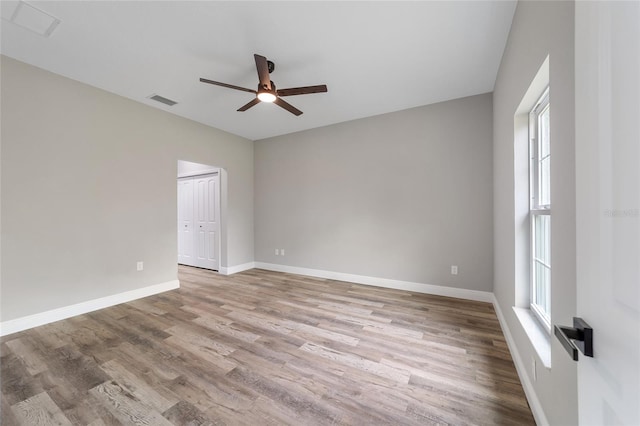 spare room featuring light hardwood / wood-style floors and ceiling fan