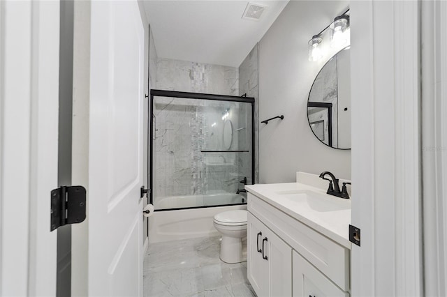 full bathroom featuring bath / shower combo with glass door, vanity, and toilet