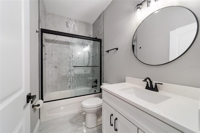 full bathroom featuring toilet, vanity, and shower / bath combination with glass door