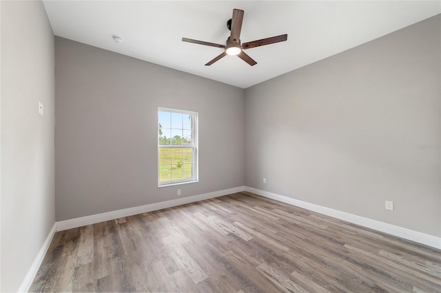 empty room featuring ceiling fan and light wood-type flooring