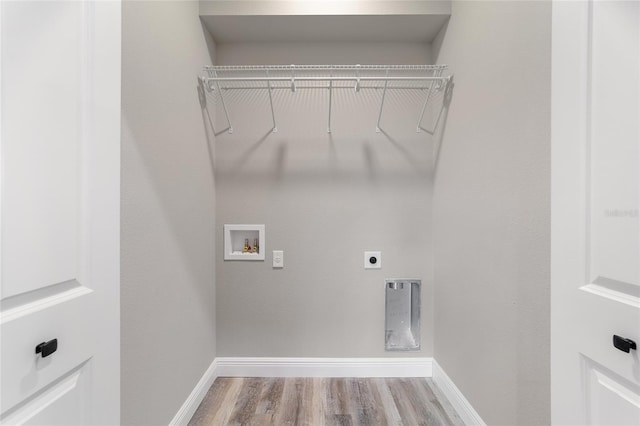 laundry room featuring hookup for an electric dryer, light wood-type flooring, and hookup for a washing machine