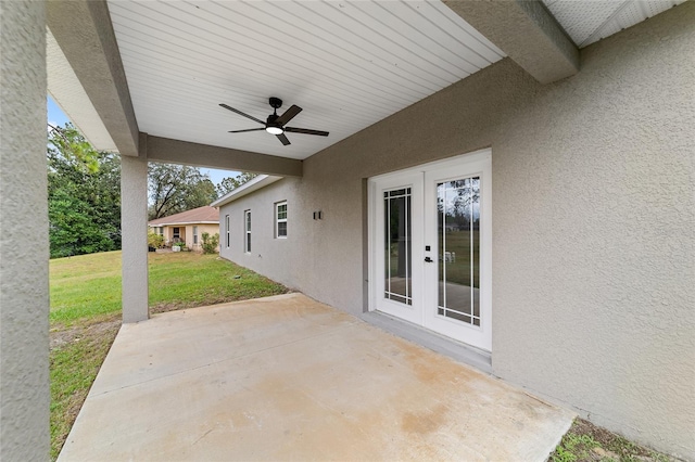 view of patio featuring french doors and ceiling fan