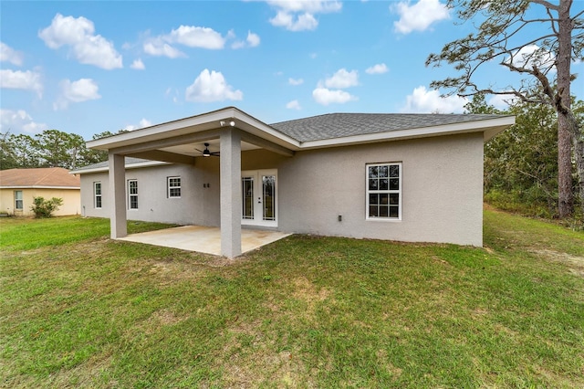 back of house featuring a patio area, a yard, french doors, and ceiling fan