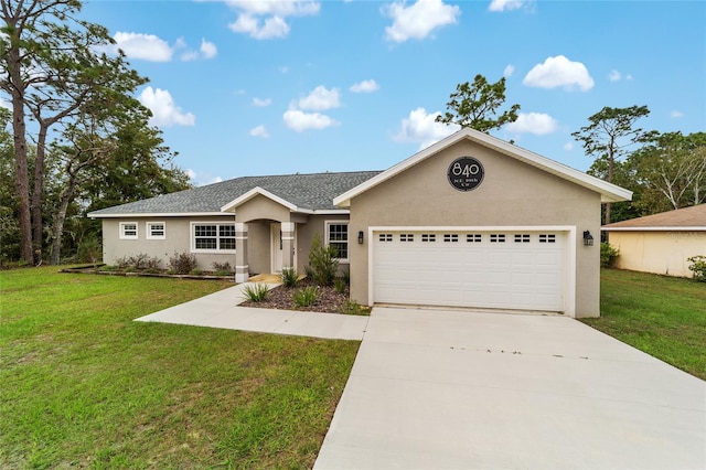 ranch-style house featuring a garage and a front yard