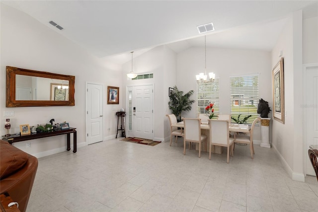 dining room featuring lofted ceiling and an inviting chandelier