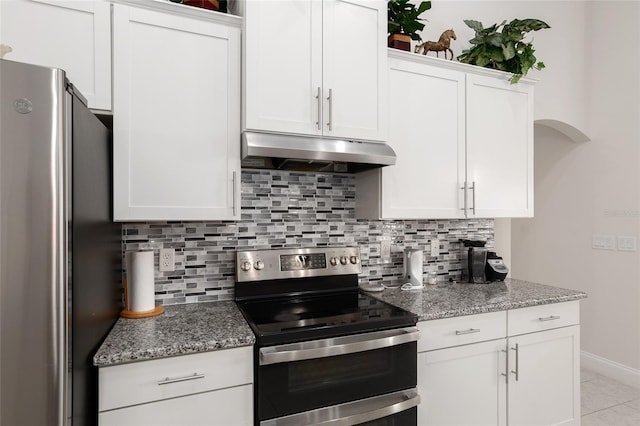 kitchen with white cabinets, backsplash, light stone counters, and stainless steel appliances