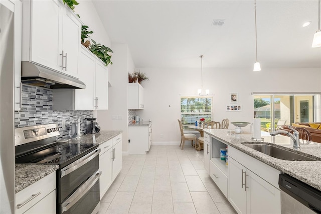 kitchen featuring light stone countertops, appliances with stainless steel finishes, sink, decorative light fixtures, and white cabinets