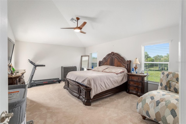 bedroom with light carpet, vaulted ceiling, and ceiling fan