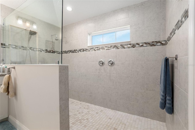 bathroom with tiled shower