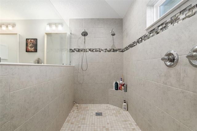 bathroom featuring a tile shower