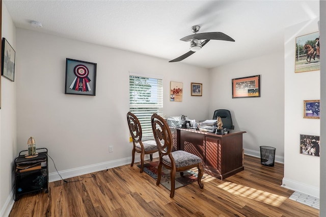 office with ceiling fan and wood-type flooring