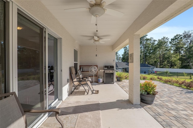 view of patio / terrace featuring a grill and ceiling fan