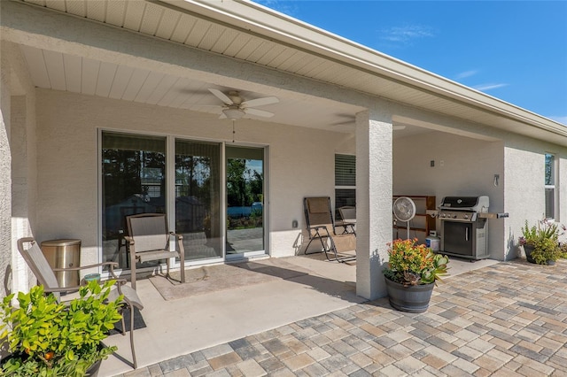 view of patio / terrace featuring ceiling fan and a grill