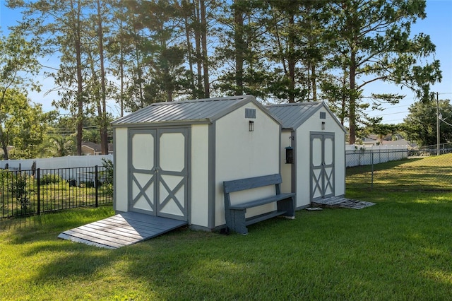 view of outbuilding featuring a yard