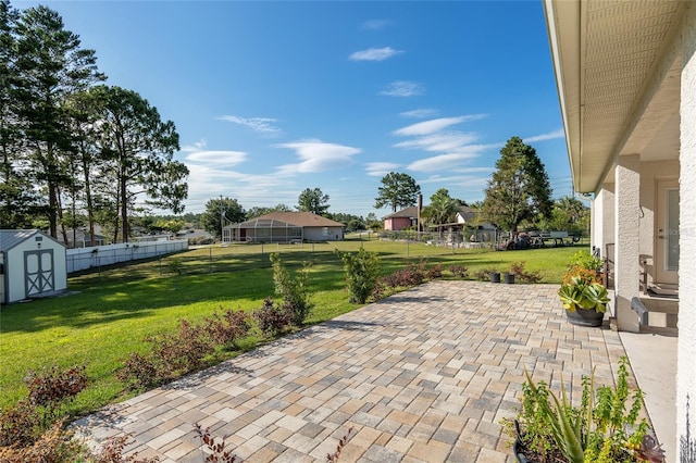 view of patio featuring a storage unit