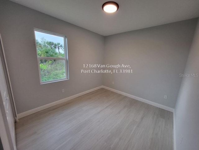 spare room with light wood-type flooring