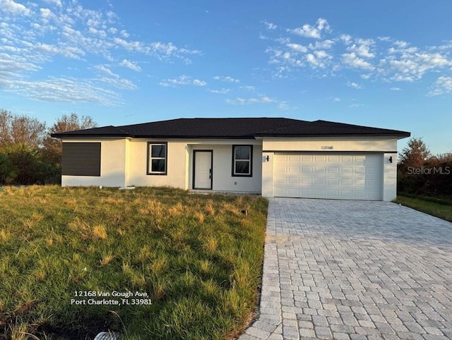 ranch-style house featuring a garage