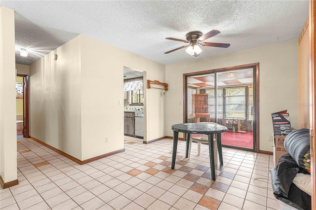 dining room with ceiling fan, light tile patterned floors, and a textured ceiling